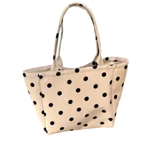 White polka dot canvas tote bag, casual large capacity shoulder bag for women daily commute.