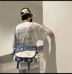 Japanese style canvas messenger bag for men and women, large capacity casual contrast color shoulder bag.