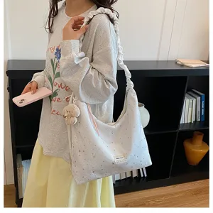 Casual star print canvas shoulder bag detail showing lazy style slouchy design and cute bear charm.
