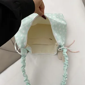 Mint green polka dot canvas tote bag with cute scrunchie shoulder straps for daily casual use.
