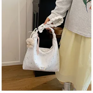 Sweet star print tote bag with ruffled handle and cute pendant for women daily casual use detail.