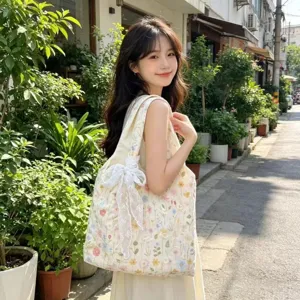 Floral embroidered canvas tote bag with white lace bow, casual large capacity shoulder bag for women.