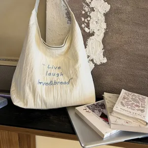 Large capacity letter embroidered canvas tote bag, stylish Korean style shoulder bag for women.