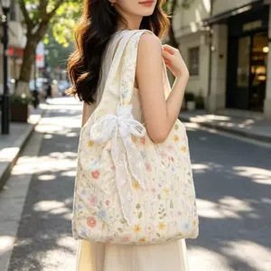 Casual floral embroidered canvas tote bag with white lace bow for women daily commuting.