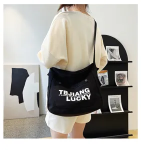 Fashion canvas shoulder bag for women, large capacity crossbody tote with letter print.