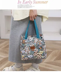 Canvas lunch bag detail, cute cat pattern print, durable fabric handle for daily office use