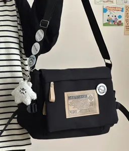 Japanese vintage black canvas messenger bag, large capacity casual crossbody bag for daily use.