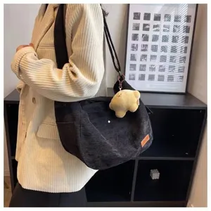 Black corduroy shoulder tote bag for women, casual daily commuter handbag with cute plush charm.