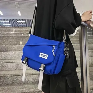 Casual canvas messenger bag for daily commute, royal blue crossbody shoulder style.