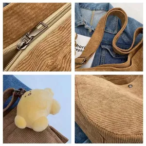 Corduroy tote bag detail showing zipper, strap, cute bear pendant and bottom curve.