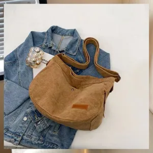 Chic corduroy shoulder bag with wide strap, perfect for autumn winter daily commute.