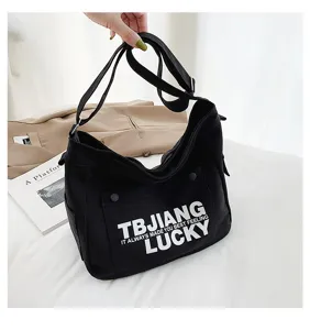 Black canvas tote bag casual shoulder crossbody bag with large capacity and letter print details.