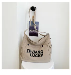 Canvas crossbody bag for women, large capacity canvas shoulder tote with letter print.