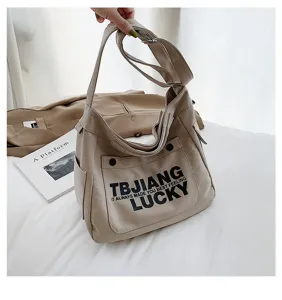 Casual canvas shoulder crossbody tote bag for women with stylish letter print. Large capacity daily