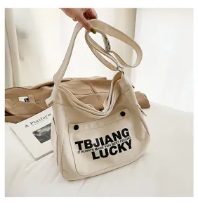 Large capacity canvas shoulder crossbody bag with stylish letter print for women college style