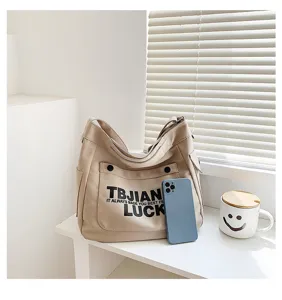 Casual canvas shoulder tote bag with letter print, spacious design for daily use and students.
