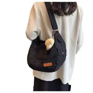 Women black corduroy shoulder bag casual large capacity tote crossbody bag with cute plush pendant.