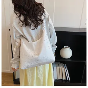 Large capacity starry print tote bag for women, casual style fabric shoulder bag detail.