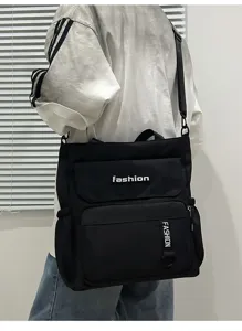 Detailed view of black canvas shoulder bag, large capacity crossbody messenger bag for students.