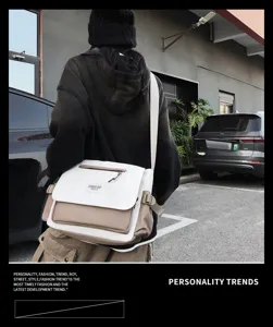 Detail view of stylish canvas messenger bag, large capacity crossbody bag for daily street wear.
