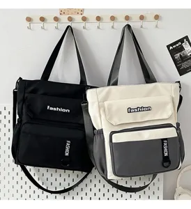 Large capacity canvas shoulder messenger bag, fashionable versatile daily casual tote for students.
