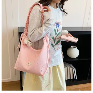 Pink star print tote bag with ruffled strap and cute bear pendant for women daily use.