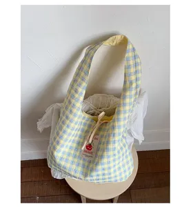 Japanese style plaid canvas tote bag detail view, casual yellow and blue shoulder bag design.