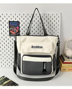 Large capacity canvas tote bag for women, stylish contrast color shoulder crossbody bag.