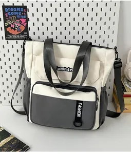 Details of the black and white color block large capacity canvas tote and shoulder bag.