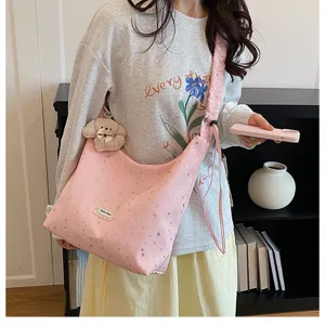 Sweet large capacity tote bag with starry print, casual lazy style pink crossbody bag for women.