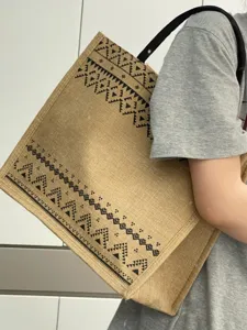 Large capacity jute tote bag with black geometric tribal print, stylish commuter handbag.