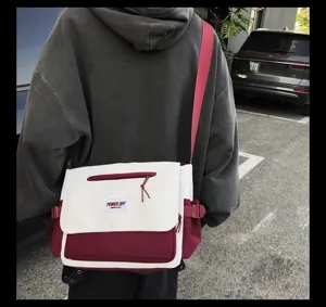 Detailed view of large capacity nylon messenger bag, stylish contrast color canvas cross body.