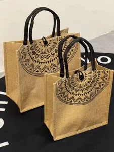 Natural jute tote bag with black handles and ethnic geometric print, stylish Mori style daily handbag.