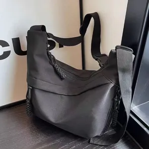 Stylish black nylon crossbody dumpling bag for women, large capacity, trendy casual hobo design.