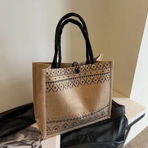 Casual jute tote bag for women, retro geometric pattern canvas handbag with comfortable black handles.
