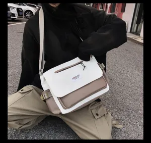 Stylish contrast color canvas messenger bag, large capacity crossbody bag for daily use.