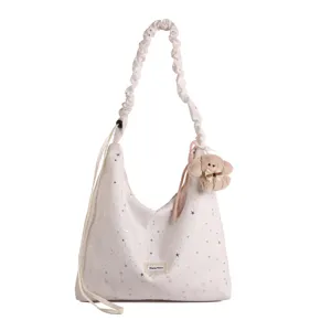 Sweet starry print canvas tote bag with plush charm and stylish gathered shoulder strap for women.