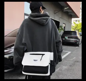 Stylish casual black and white messenger bag with large capacity, perfect for daily use.