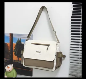 Detail shot of casual nylon messenger bag, large capacity daily crossbody student bag.