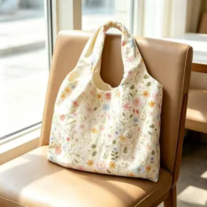 Detailed view of floral embroidered canvas tote bag, featuring delicate stitching and roomy design.