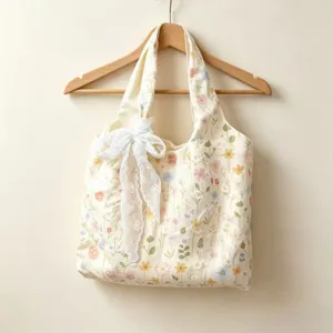 Floral embroidered canvas tote bag with elegant white lace bow, spacious casual shoulder bag for women.