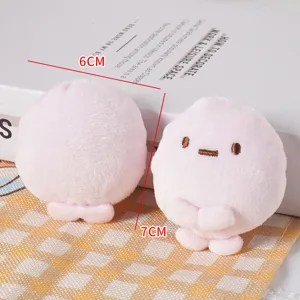 Cute pink plush round doll detail shot showing soft texture, lovely facial design.