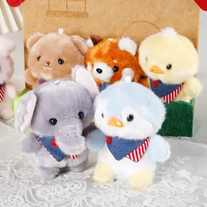 Cute animal plush toy pendants featuring cute elephants and penguins with denim bibs, detailed closeup.