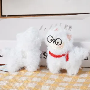 Cute fluffy alpaca plush pendant with glasses and red scarf, detailed plush toy accessory view.