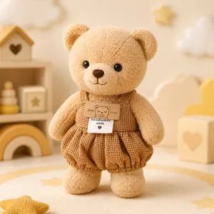 Simpatico orsetto di peluche marrone con salopette in velluto a coste decorazione per cameretta