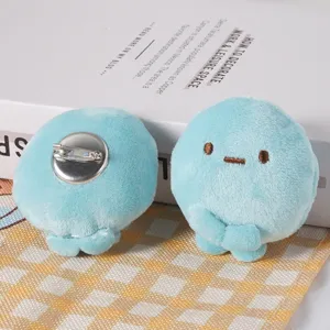 Cute plush dumpling character brooch or hair clip, soft stuffed cartoon fashion accessory.