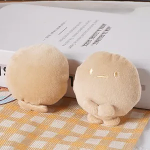 Cute plush dumpling hair clip, mini stuffed doll accessories for sweet girls and styling.