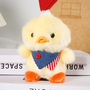 Cute yellow duck plush toy pendant bag charm fluffy stuffed animal doll with cute blue bib.