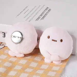 Cute pink plush dumpling brooch hairpin, soft kawaii minidoll detail showing clasp and face.