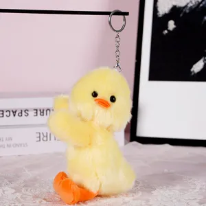 Cute yellow duck plush keychain detail, soft stuffed animal bag pendant accessory.